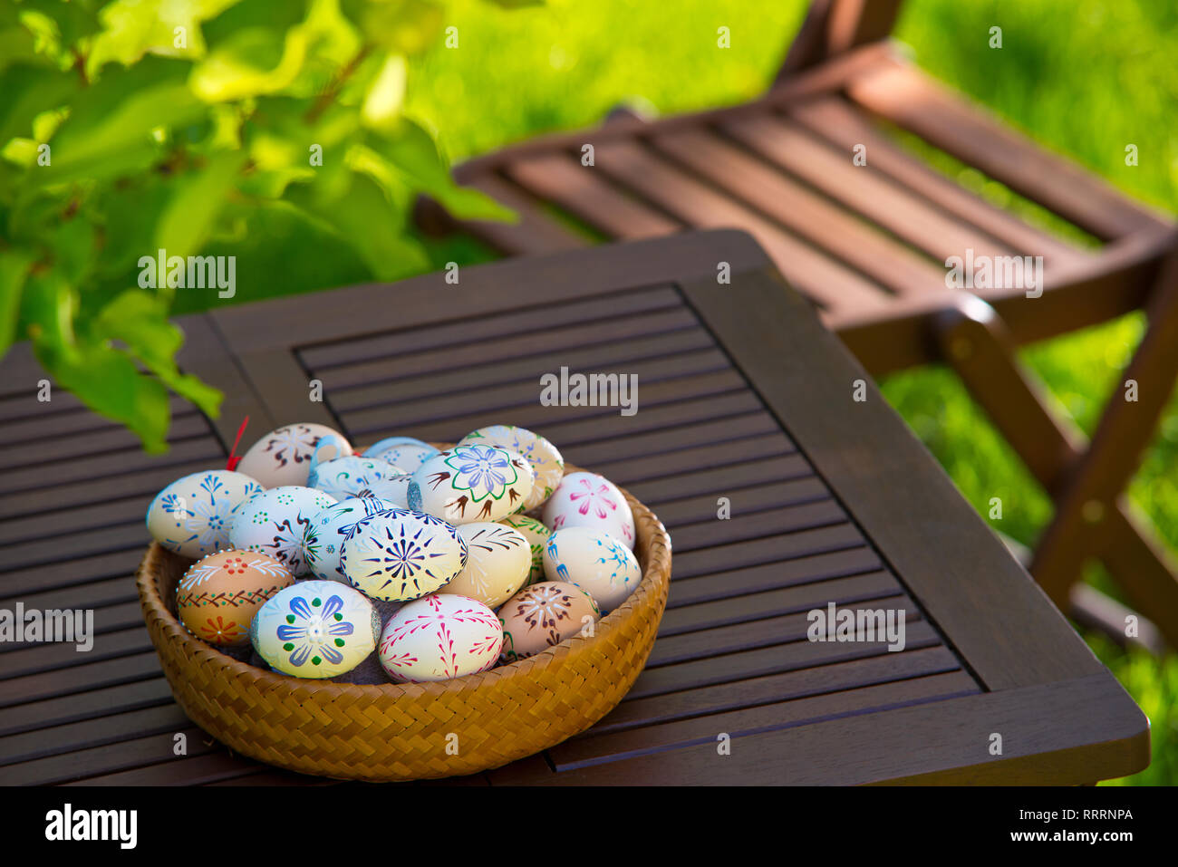 Easter eggs on the table in the garden Stock Photo
