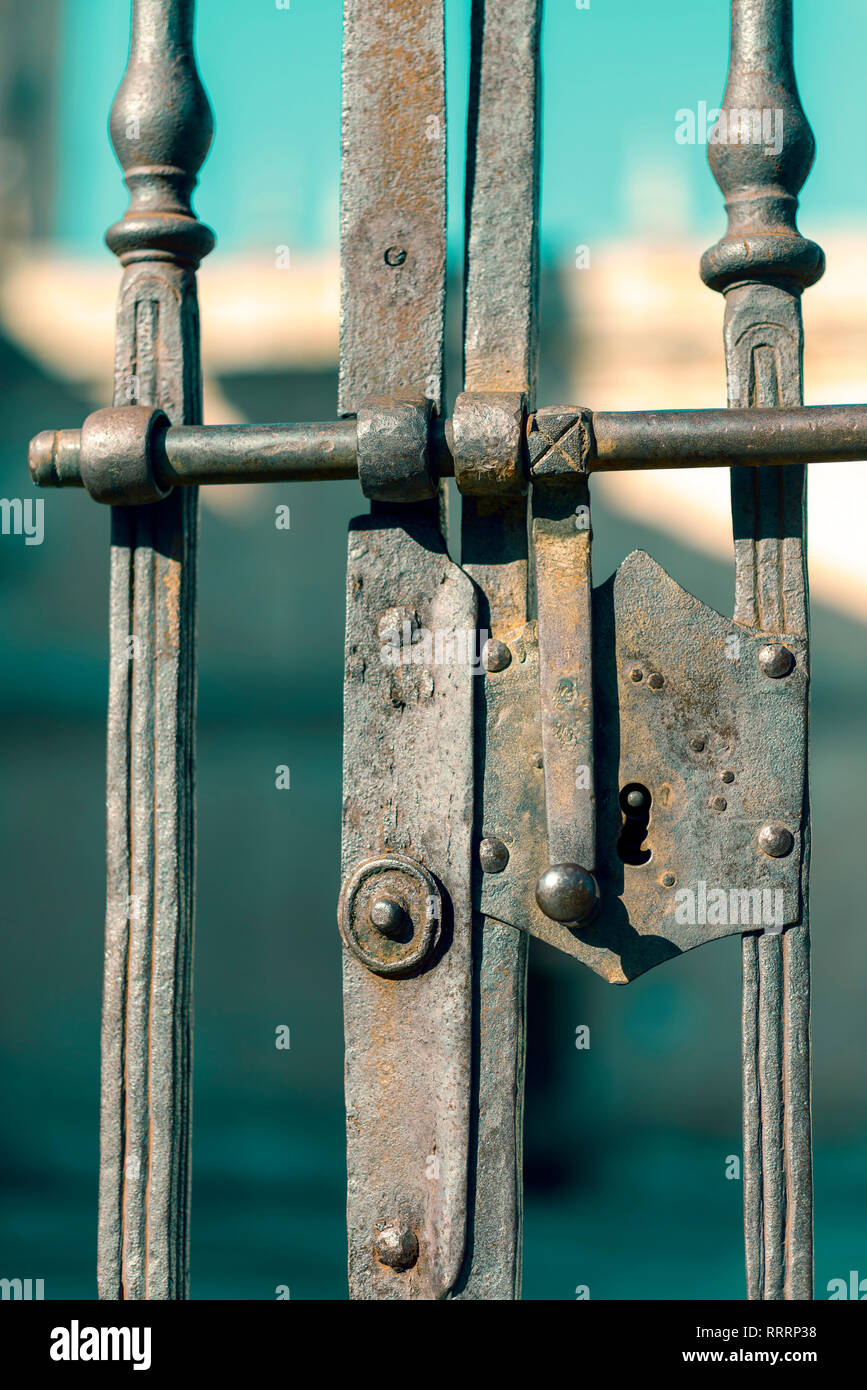 old lock on a metal fence, selective focus Stock Photo - Alamy