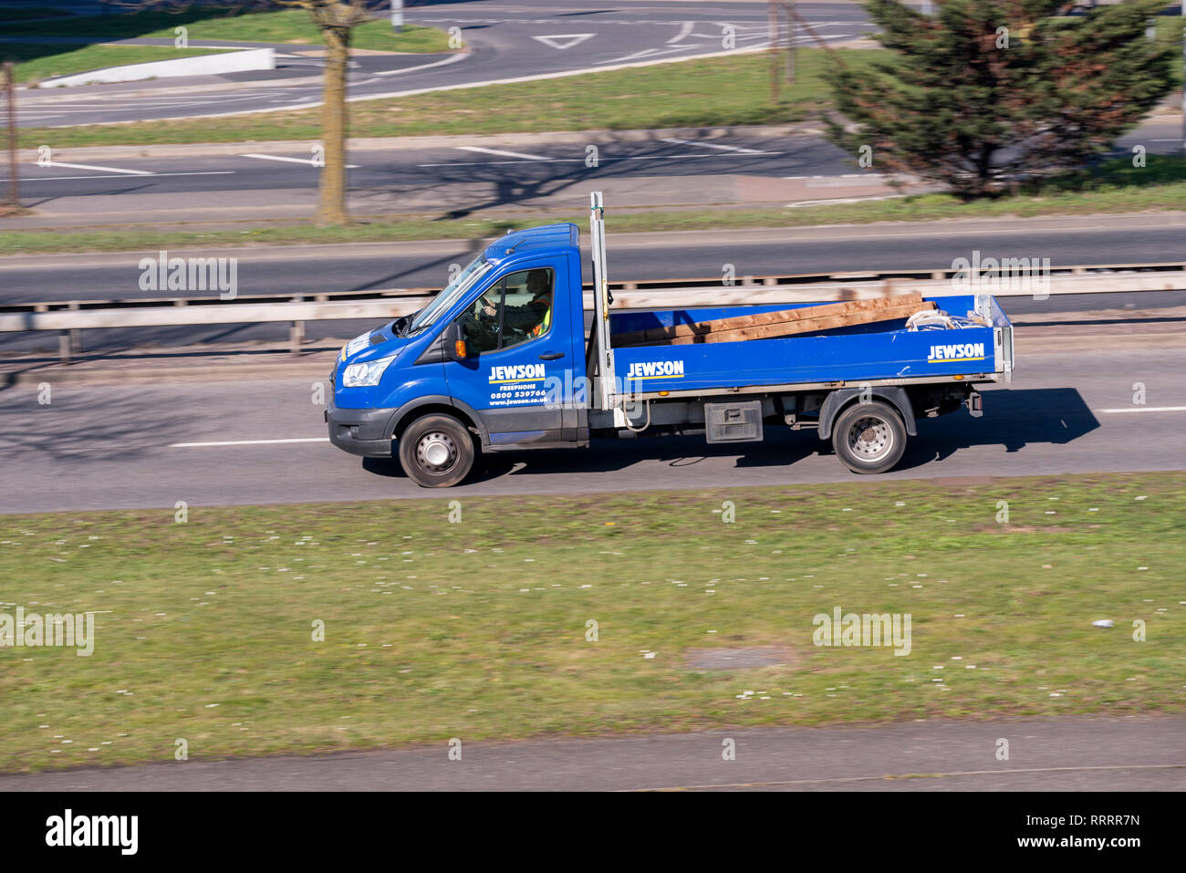 Jewson builder's merchant truck, lorry, vehicle. Carrying timber. Delivery vehicle Stock Photo
