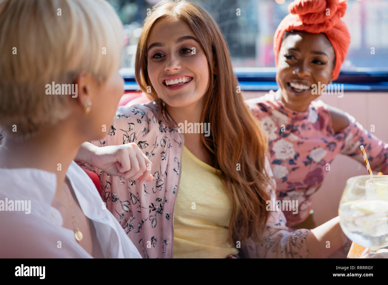 Young women friends talking in restaurant Stock Photo