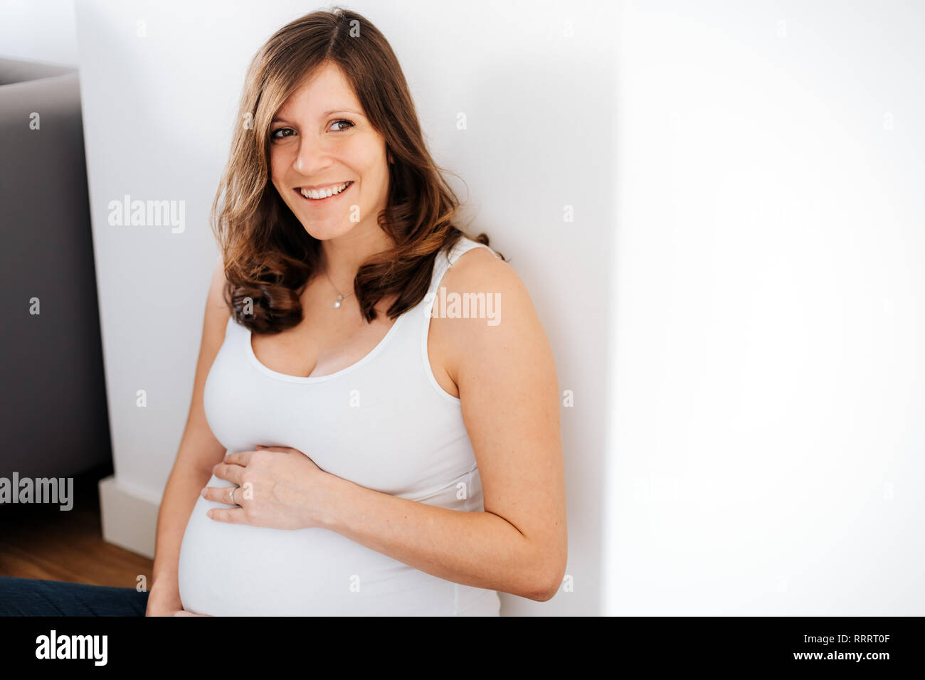 Laughing, body or holding pregnancy stomach in underwear on studio