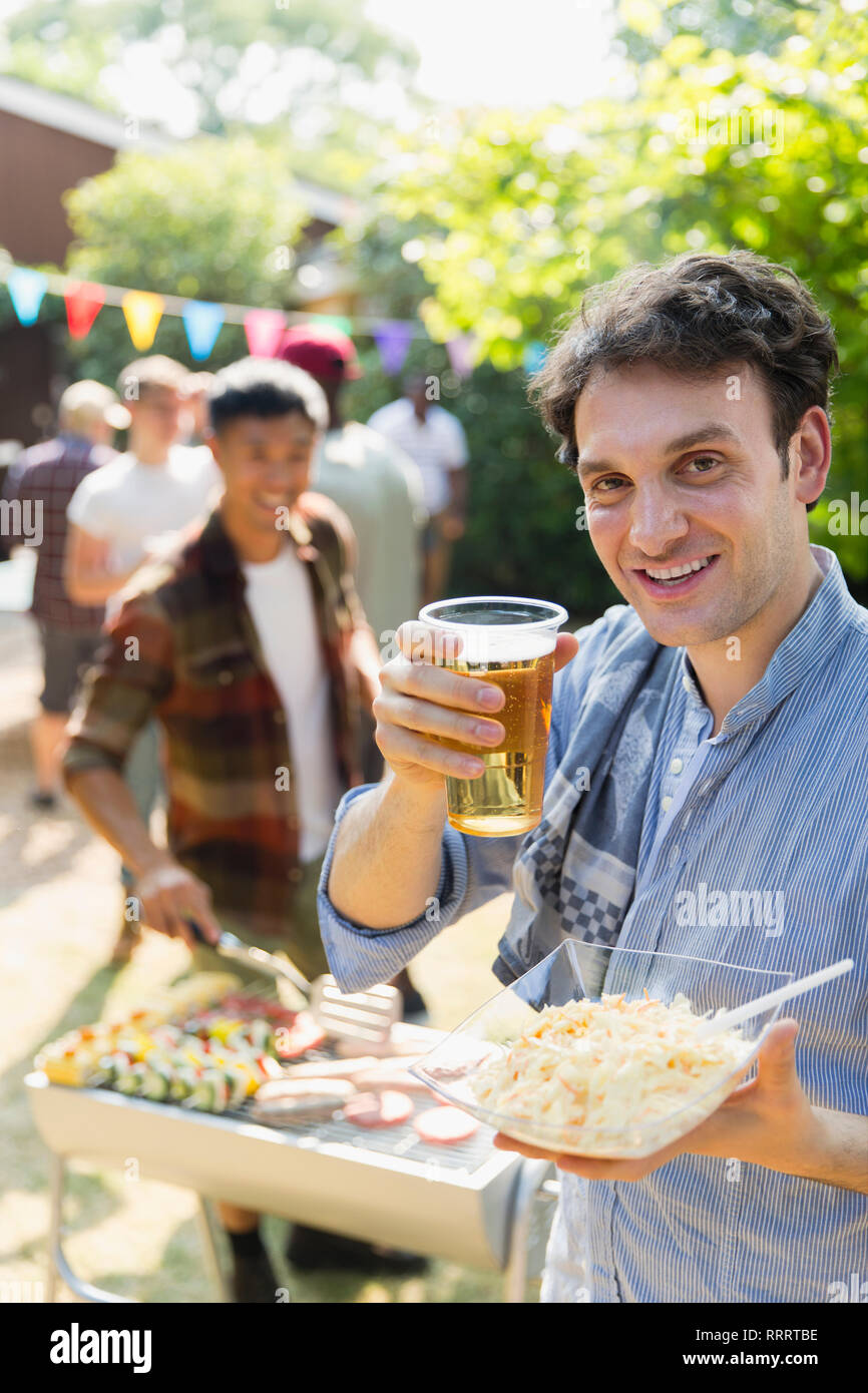 Smiling man eating and drinking hires stock photography and images Alamy