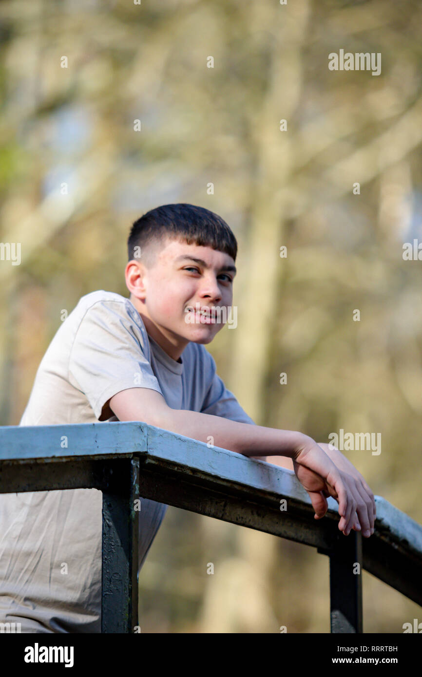 Portrait of a caucasian teenage boy outside on a spring day Stock Photo