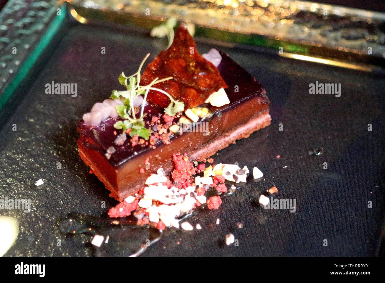 Awards night dinner, dessert, indulgent chocolate delice, violet crumble, parma violet mousse, sweetcorn shoots. Served at The Cotswold Life Food and  Stock Photo