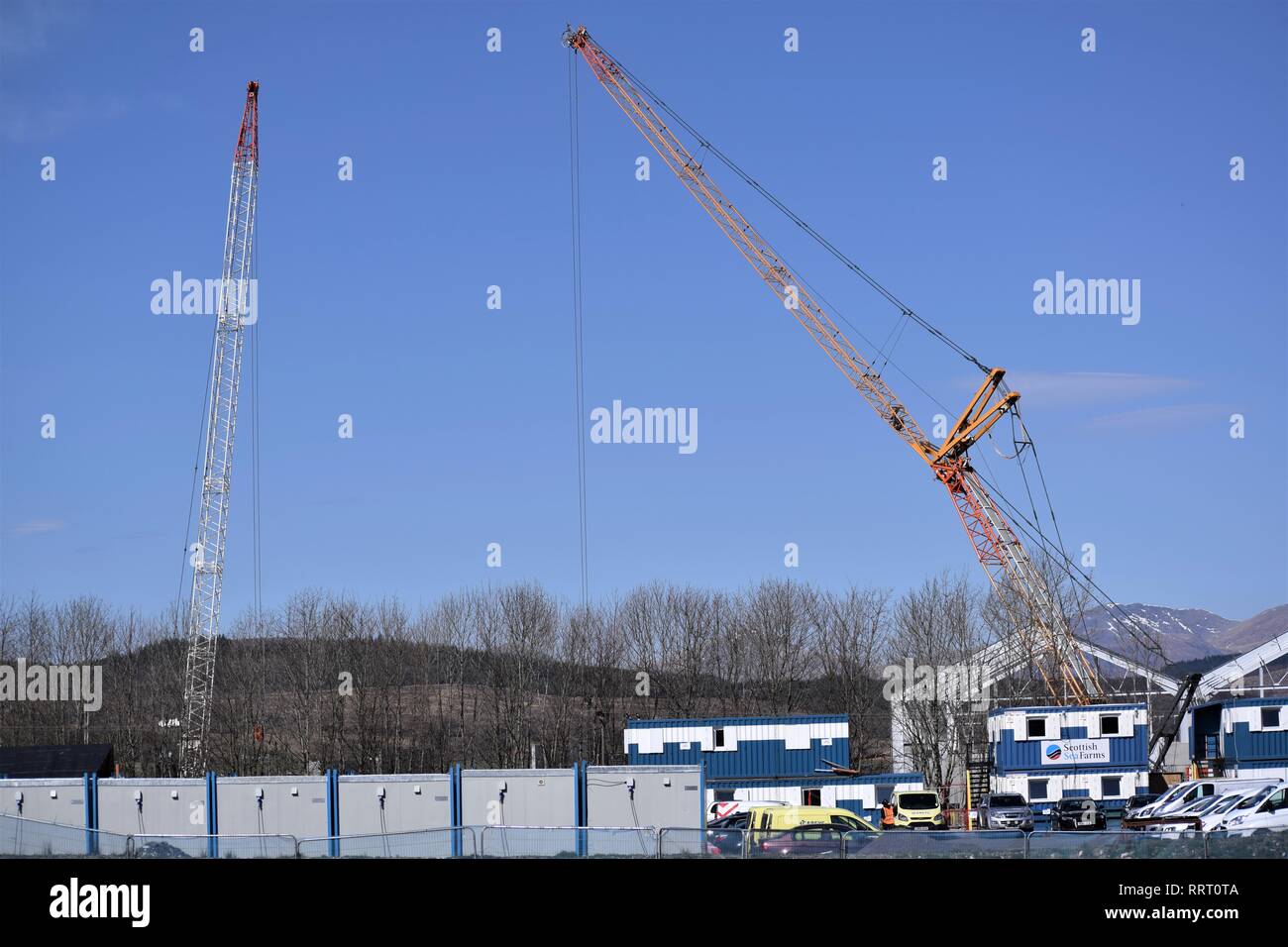 Fish Hatchery Construction Two Cranes against a glorious blue sky