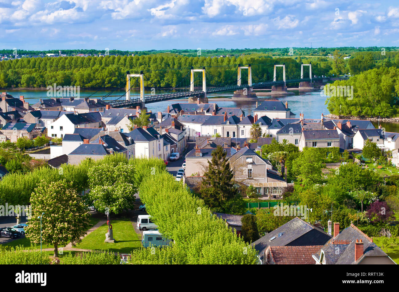 View on a French town La Pommeraye, France. Many houses among green