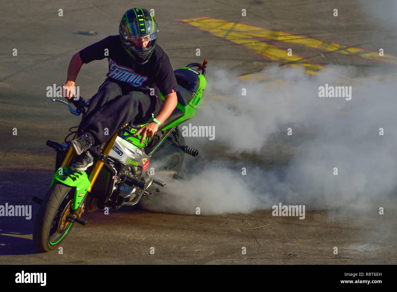 Moscow, Russia - June 7, 2015: Stunt motorcycle rider performing at a local spot. Stock Photo