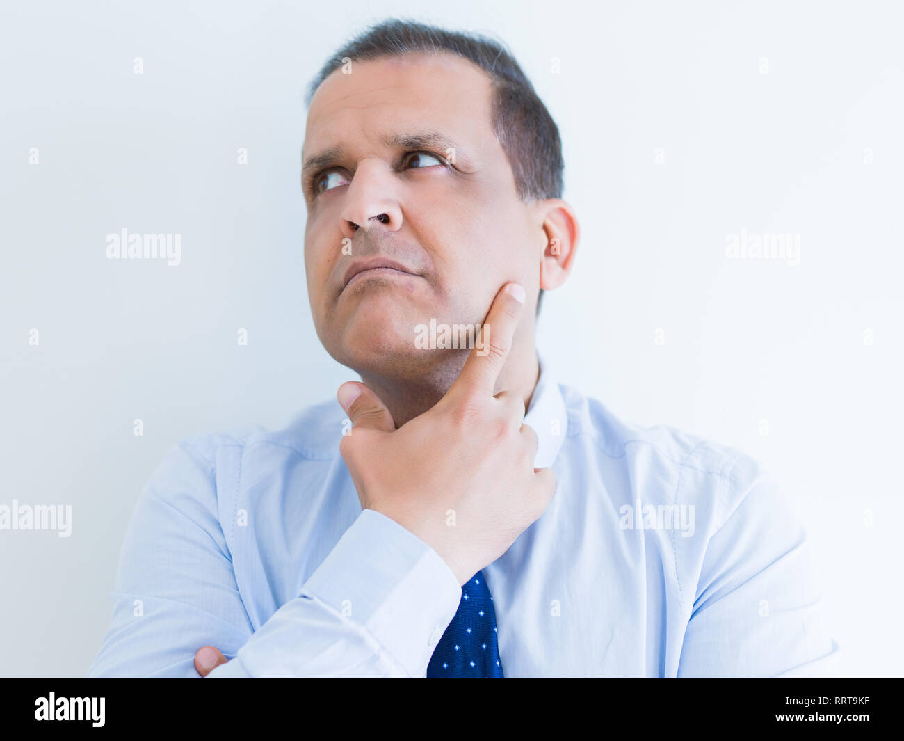 Middle age man thinking clueless about a question Stock Photo