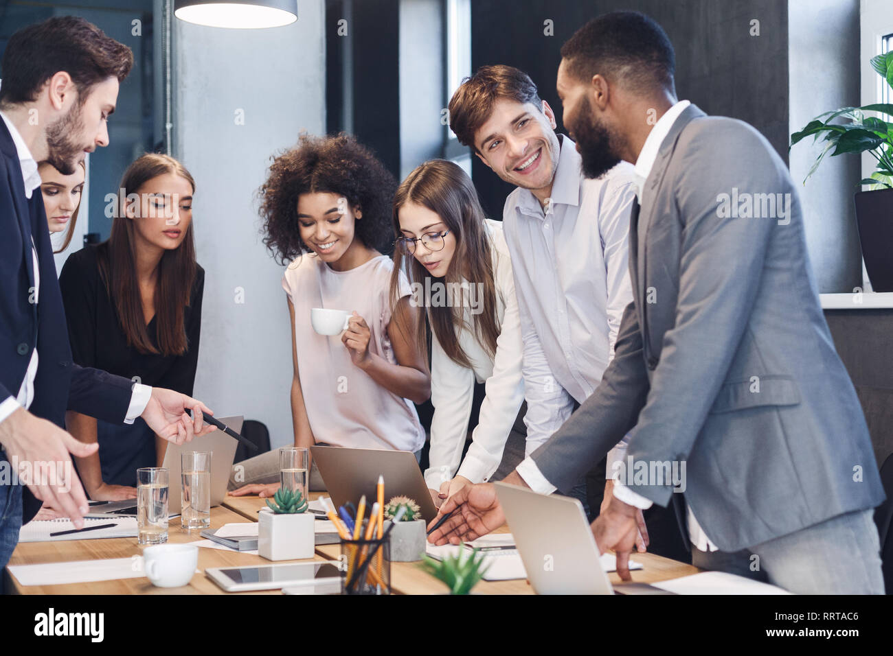 Business professionals. Group of colleagues analyzing data using computers Stock Photo