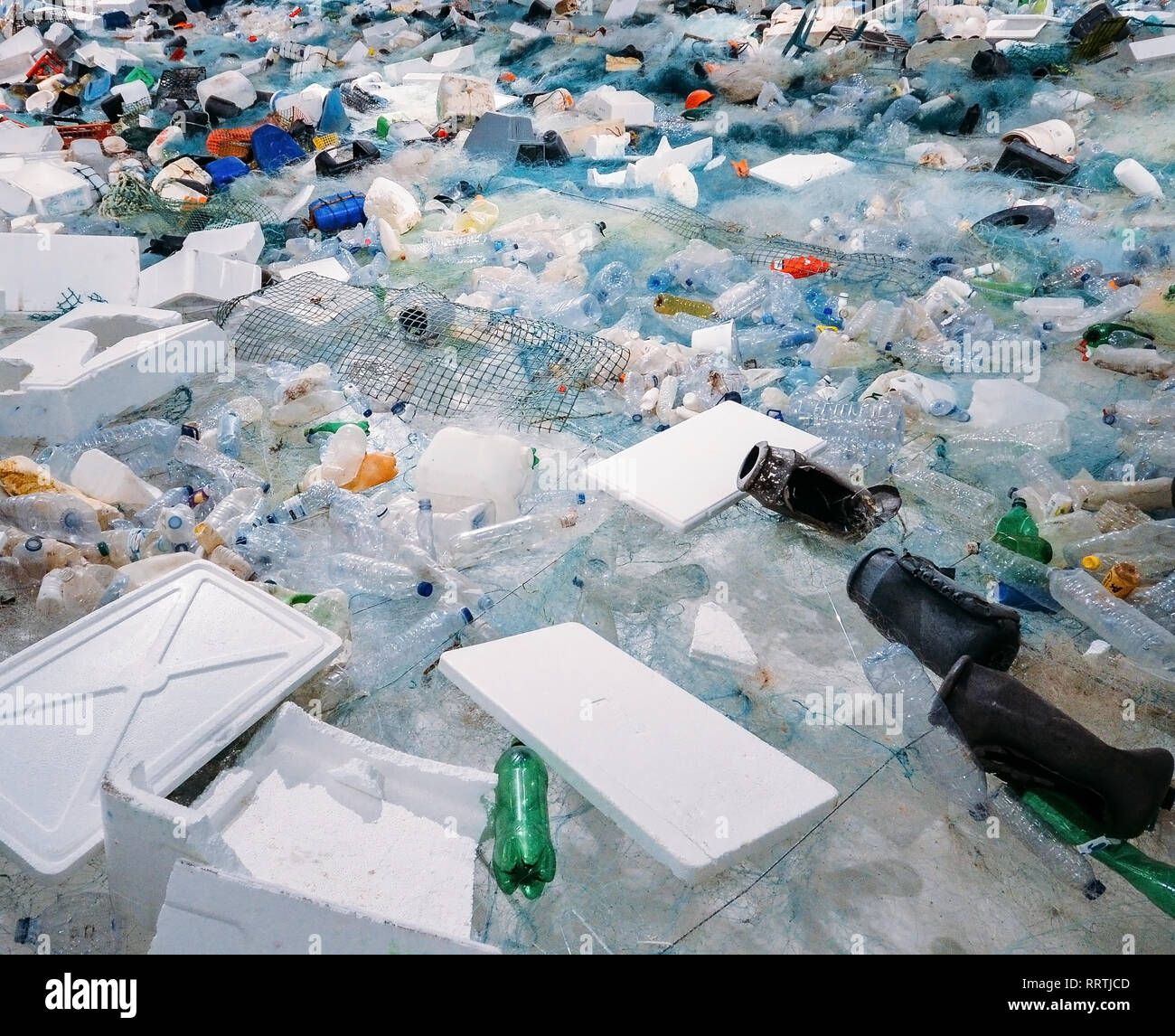 Pile of waste plastic bottles and other trash human impact on