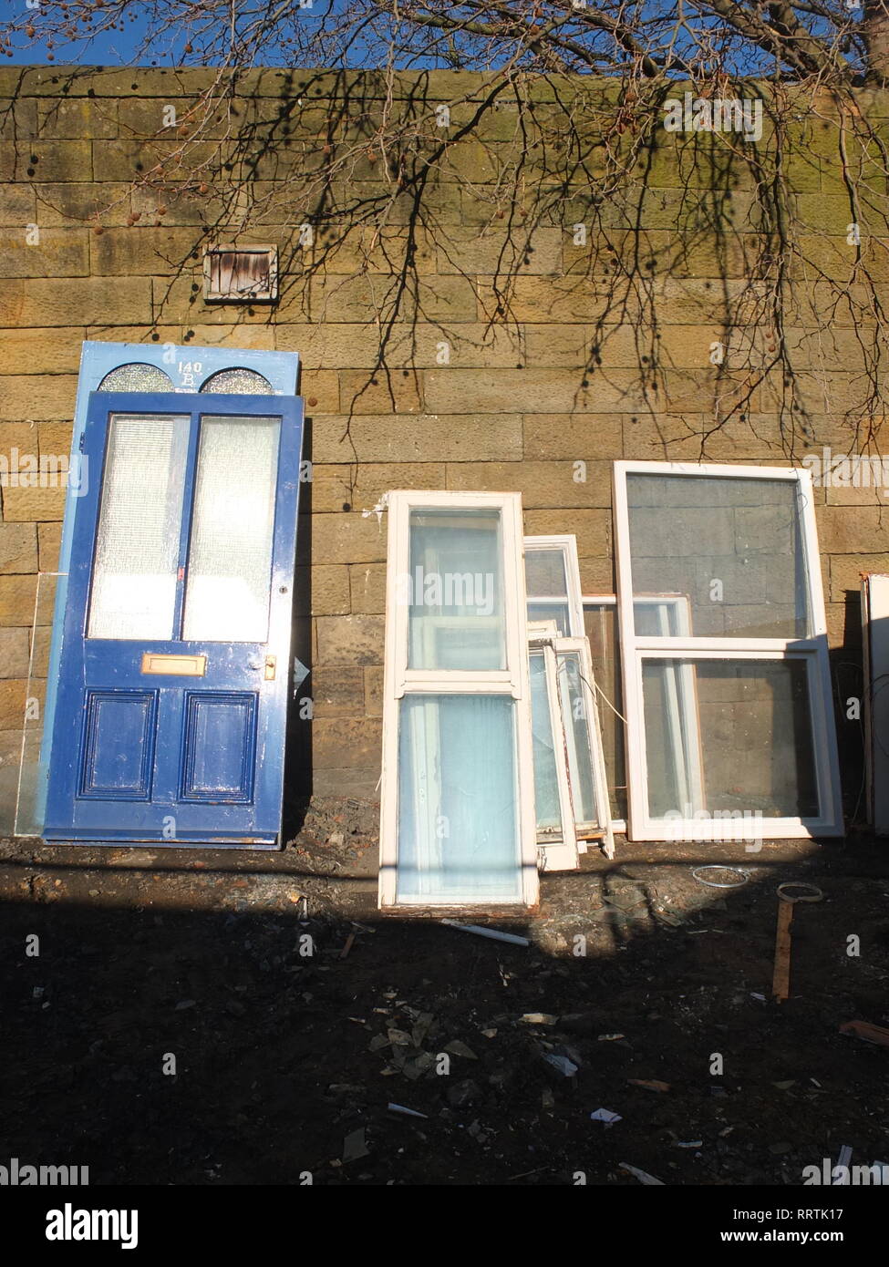 A selection of salvaged doors and windows at a reclamation yard Sheffield UK Stock Photo