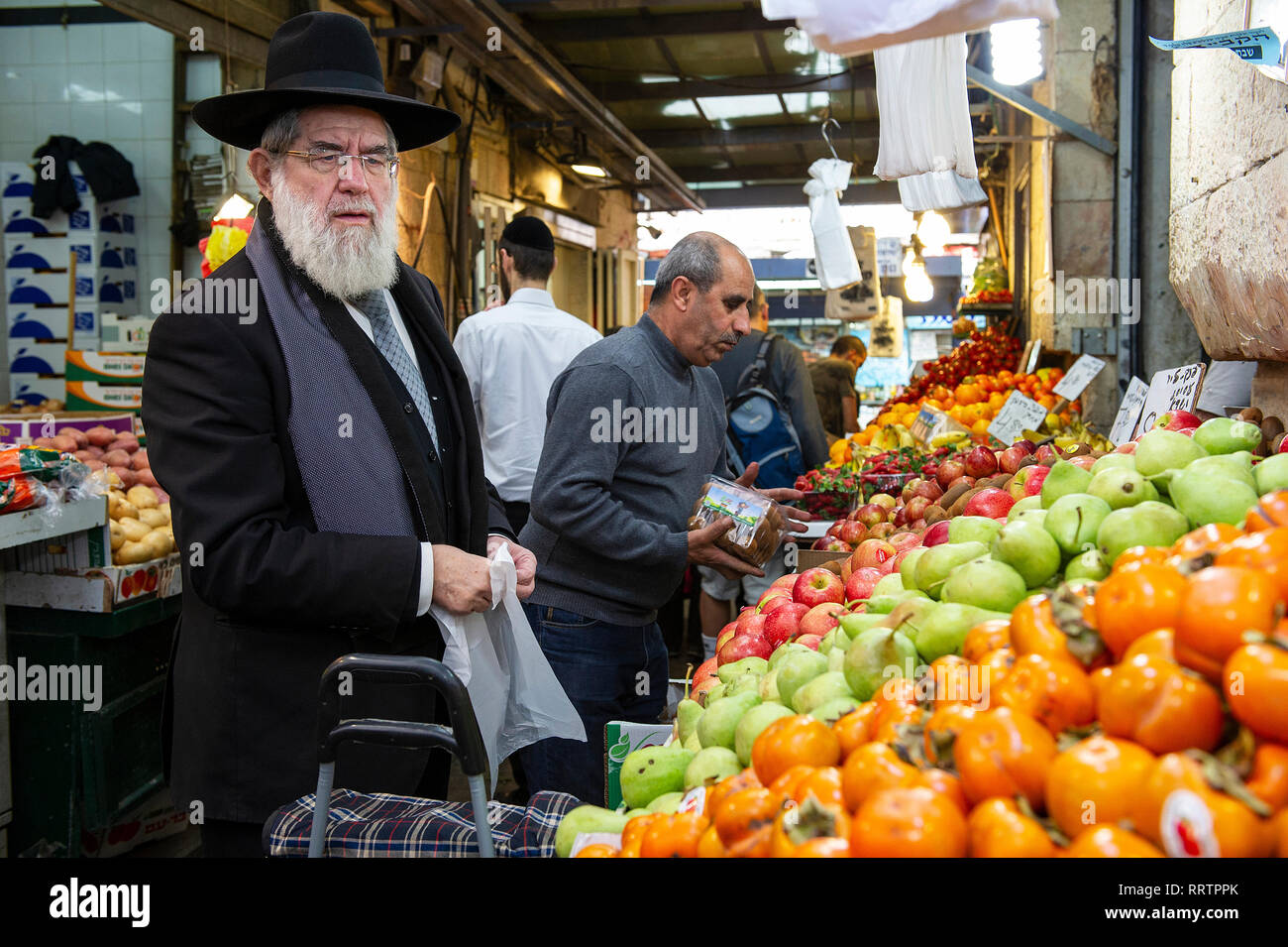 Customers browsing fruit and veg on display at Yehuda Market, Jerusalem, Israel Stock Photo