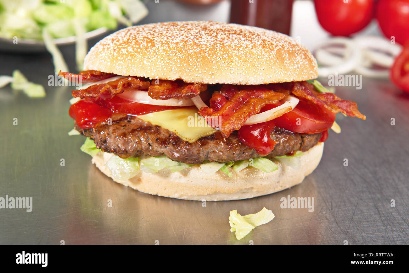 Preparing Hamburger with Bacon and Cheese Stock Photo Alamy