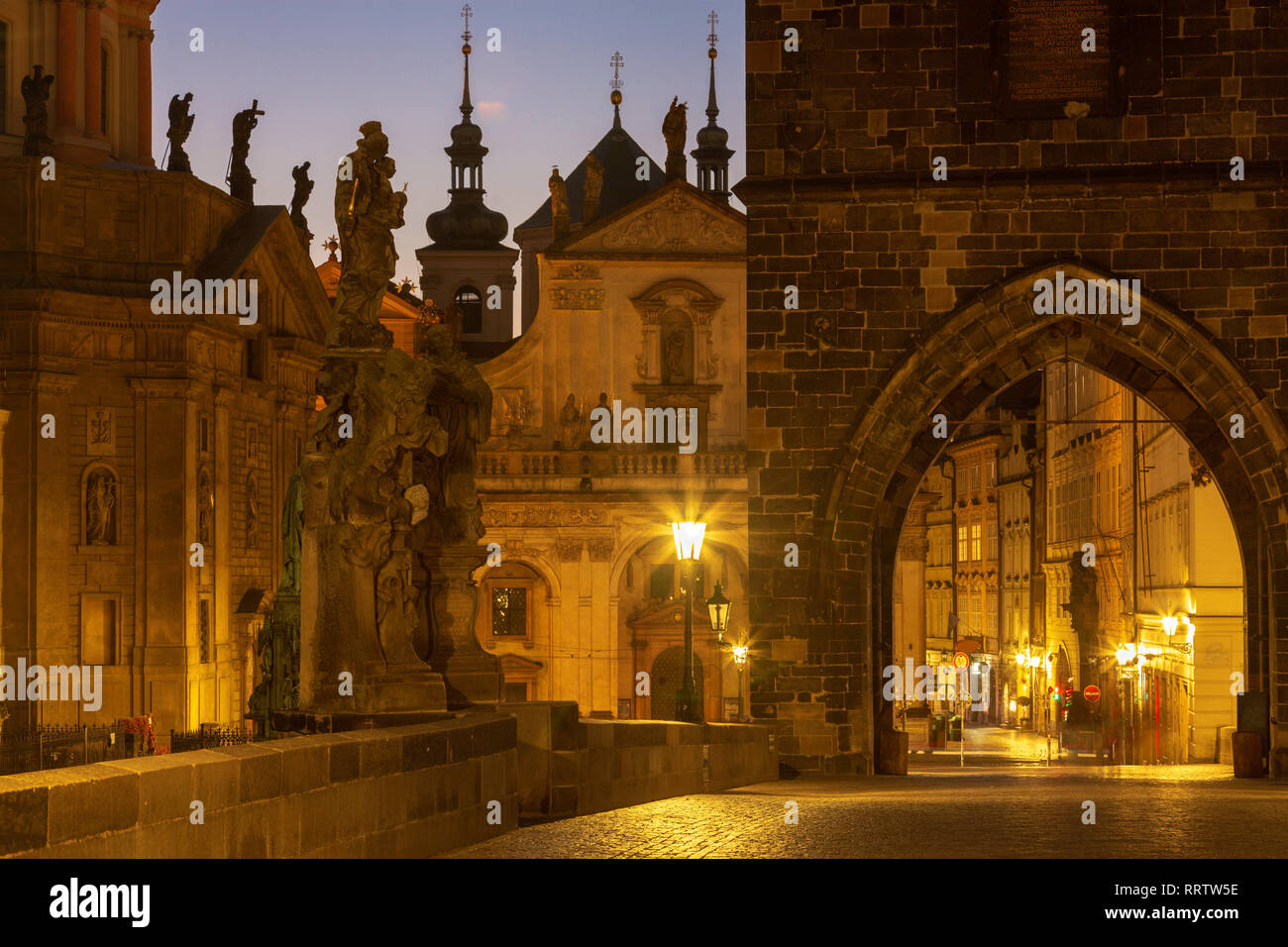 Praghe - The tower of Charles bridge and Křižovnické square in the morning. Stock Photo