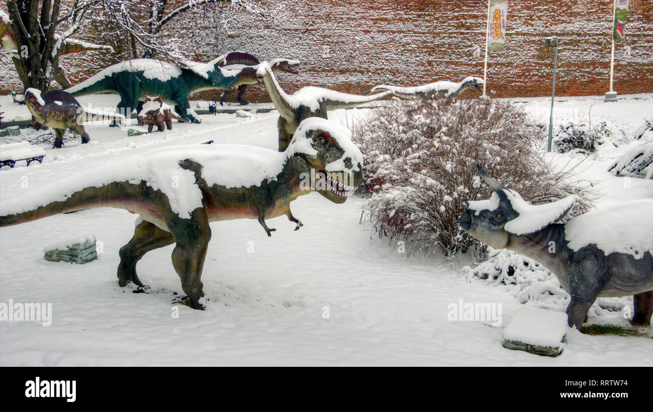 Belgrade, Serbia, January 2019 - Snow covered life size dinosaur models in Kalemegdan Dino Park Stock Photo