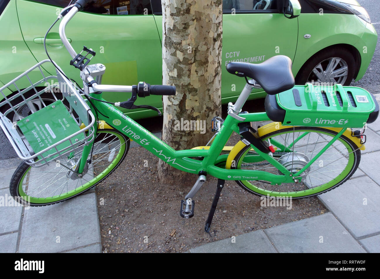 Lime-E electrically assisted rental bike parked in London street Stock Photo