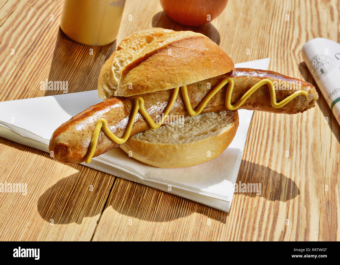Sausage in a Bun with Mustard Stock Photo Alamy