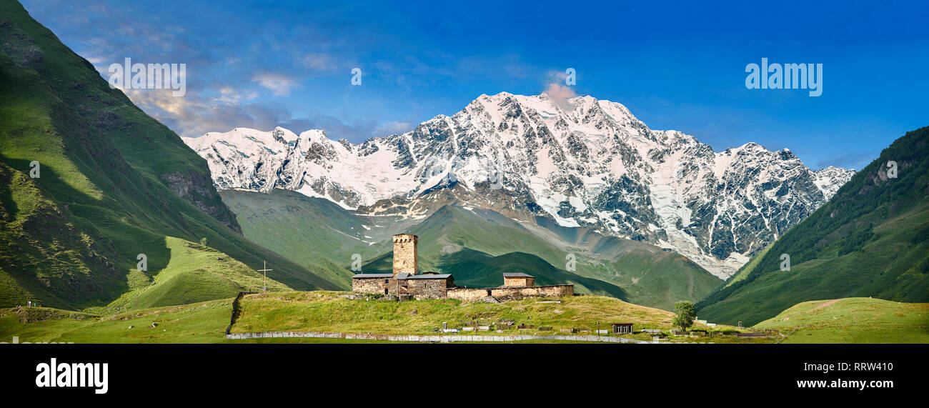 The medieval Georgian Orthodox St George Church “JGRag” with mount Shkhara (5193m) behind, Ushguli, Upper Svaneti, Samegrelo-Zemo Svaneti, Mestia, Geo Stock Photo