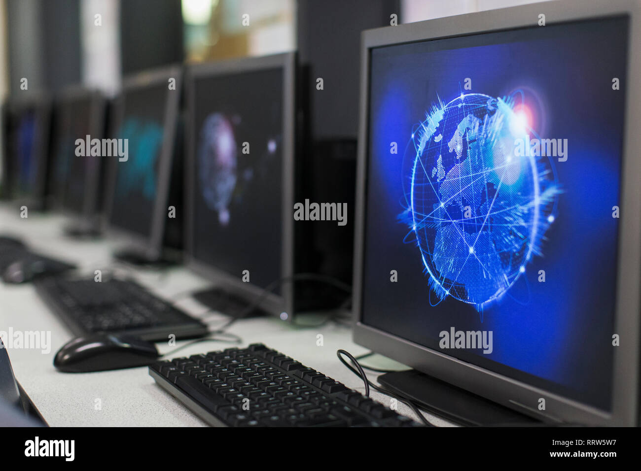 Global communications screen saver on computer in computer lab Stock Photo