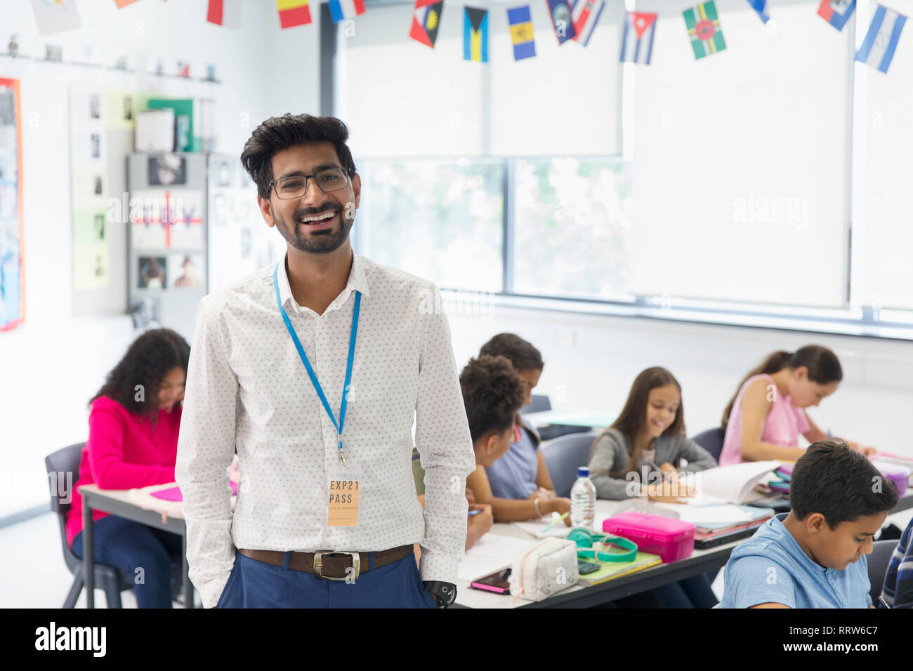 Portrait smiling, confident male teacher in classroom Stock Photo