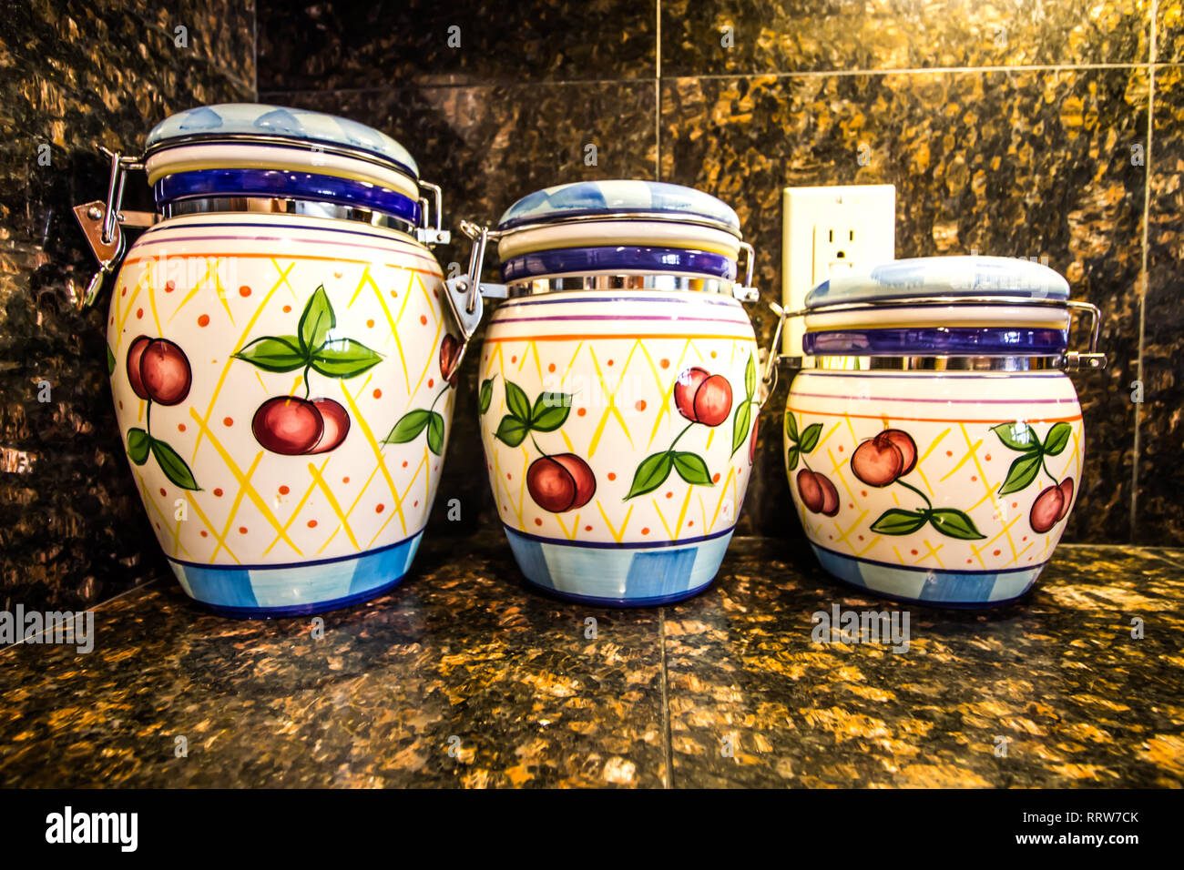 Three Kitchen Canisters On Granite Counter Stock Photo 238426515