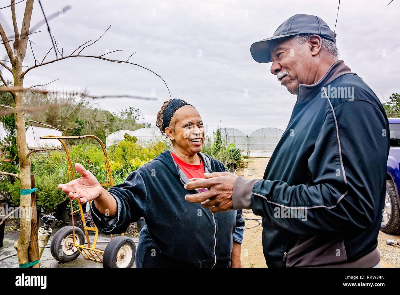 New York Mets Hall of Famer Cleon Jones, right, examines a crape myrtle tree with his wife, Angela, Feb. 19, 2019, in Theodore, Alabama. Stock Photo