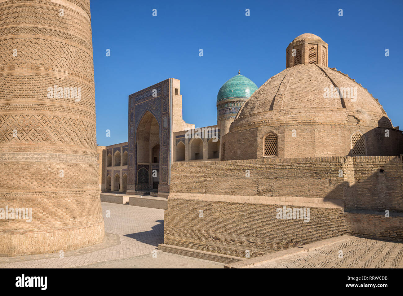 Fragment of the architectural complex Poi-Kalyan, Kalyan minaret, Miri-Arab madrasah and Amir Alimkhan madrasah Stock Photo