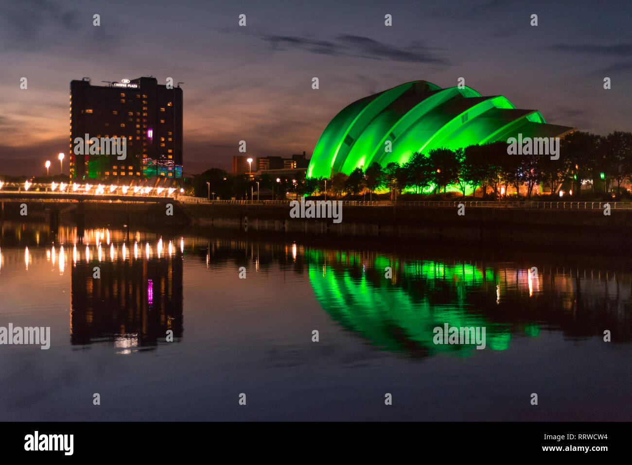 Glasgow/Scotland - September 20 2016: View of the SEC Armadillo lit up in green, reflected in the Clyde River Stock Photo