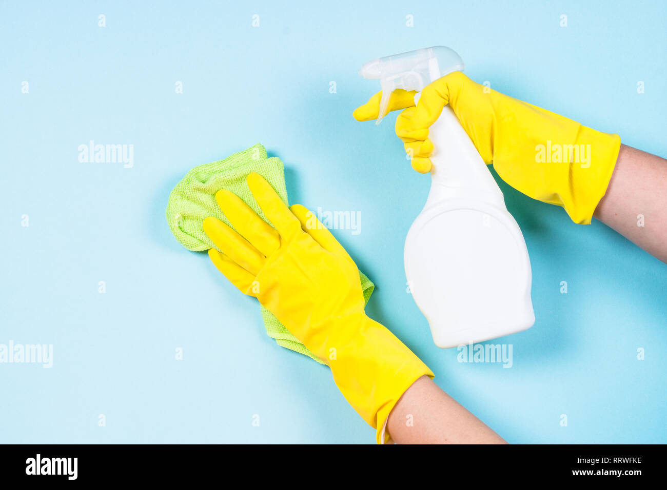 Cleaning concept on blue background Stock Photo - Alamy