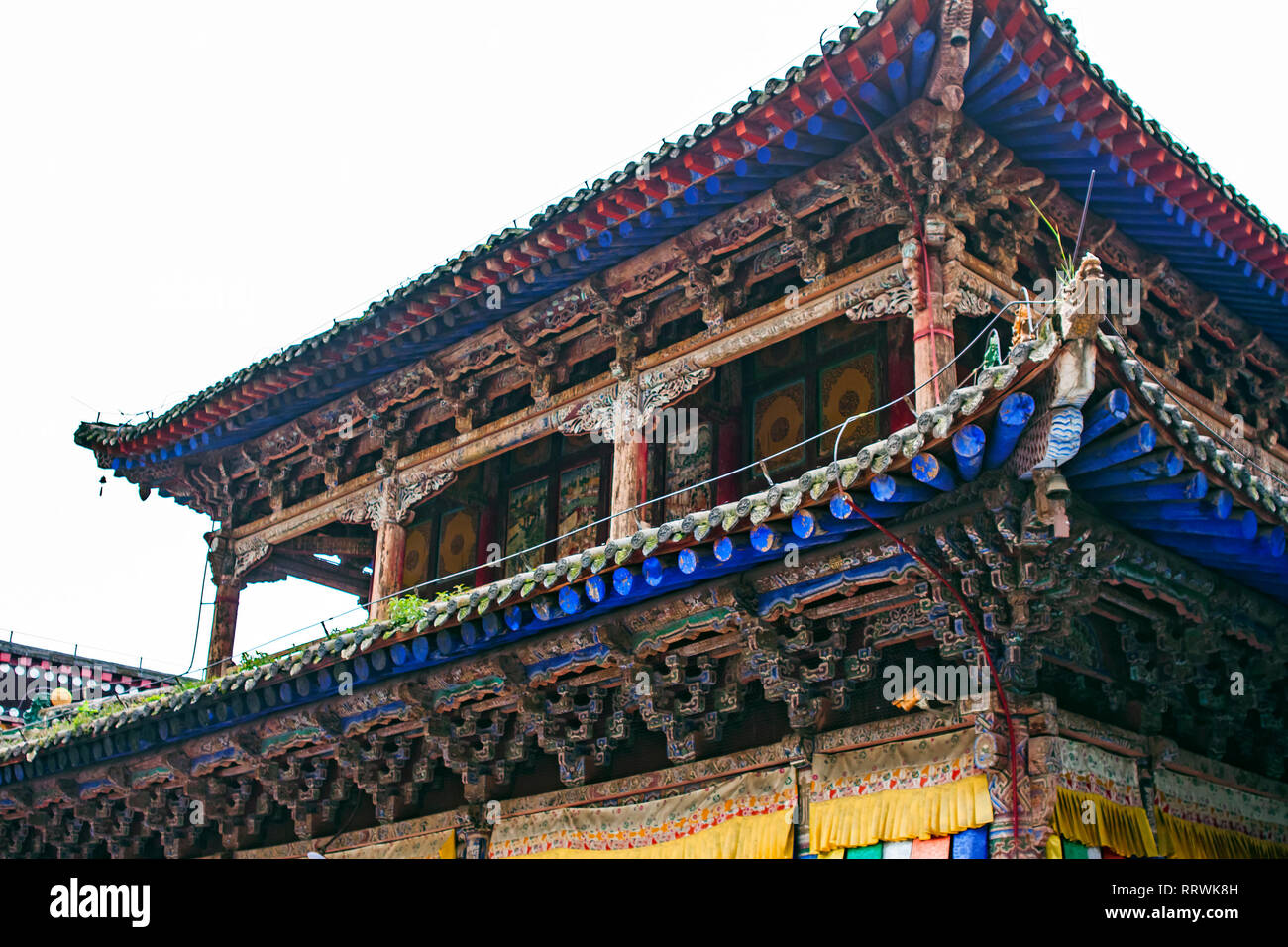 Wooden Traditional Chinese Roof Of Pagoda. Colorful Roof Structure Of Buddhist Temple. Oriental Architecture Of Kumbum Monastery in Xining. Stock Photo