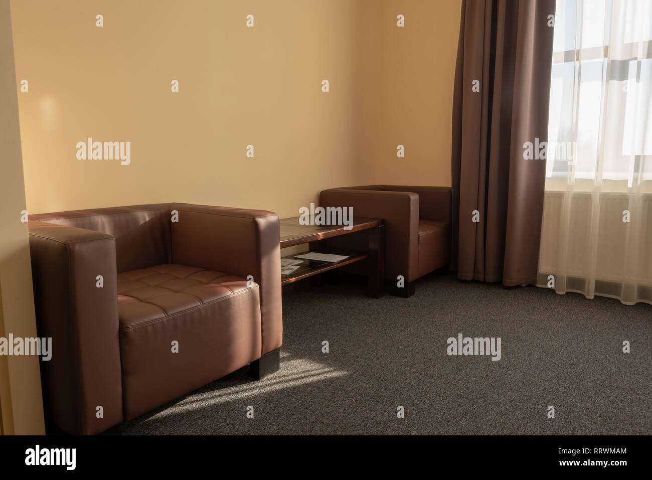 modern hotel room interior with armchairs and window Stock Photo