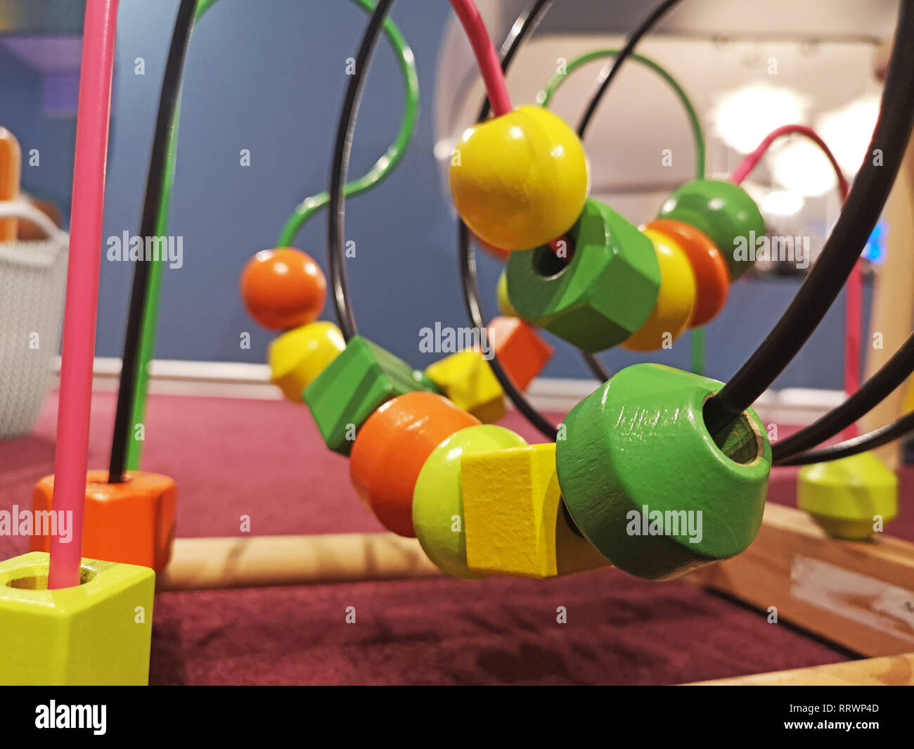 Children's educational toys labyrinth on bed room Stock Photo - Alamy