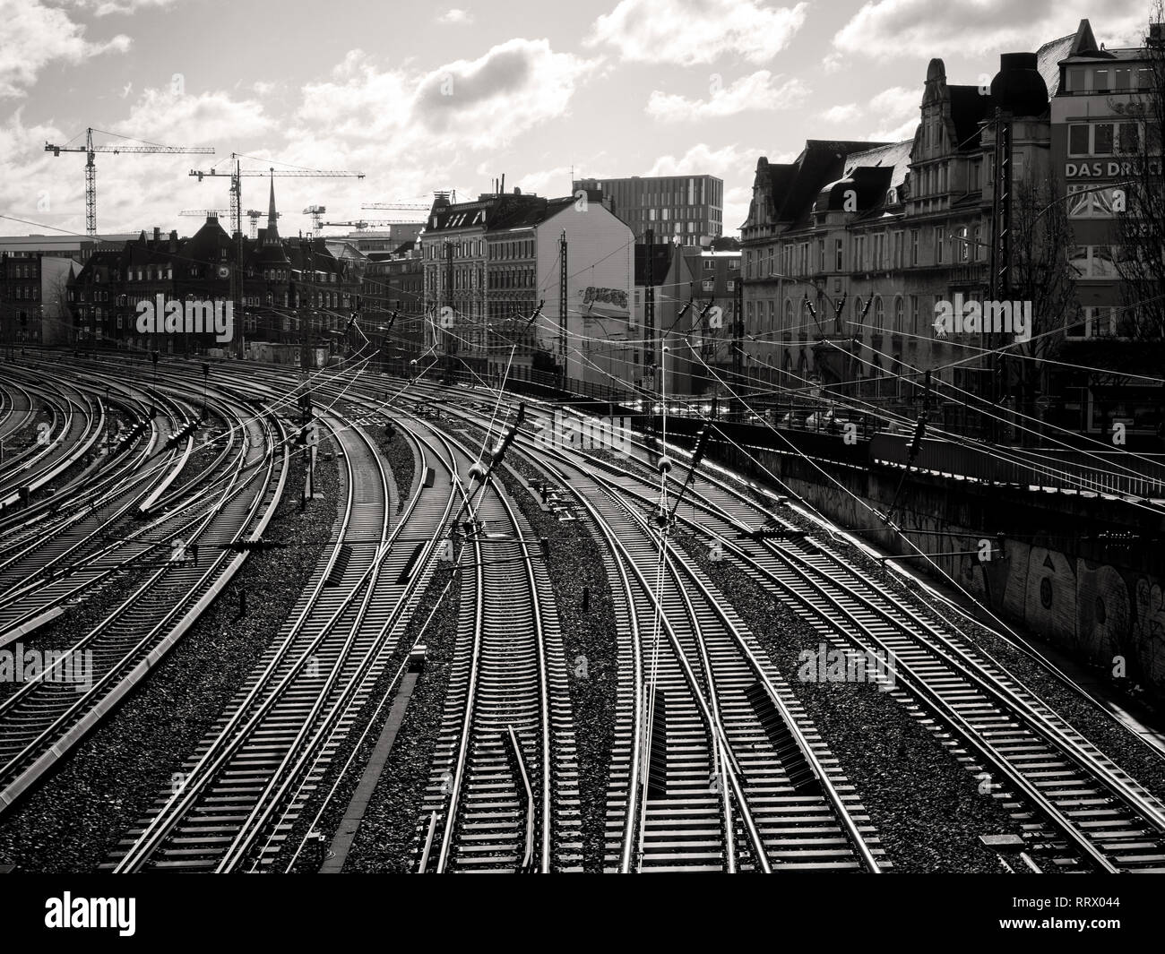 HAMBURG, GERMANY - MAR 20, 2018: Hamburg morning scene with rows of rails in perspective and traditional Hamburg architecture - black and white sepica colored Stock Photo