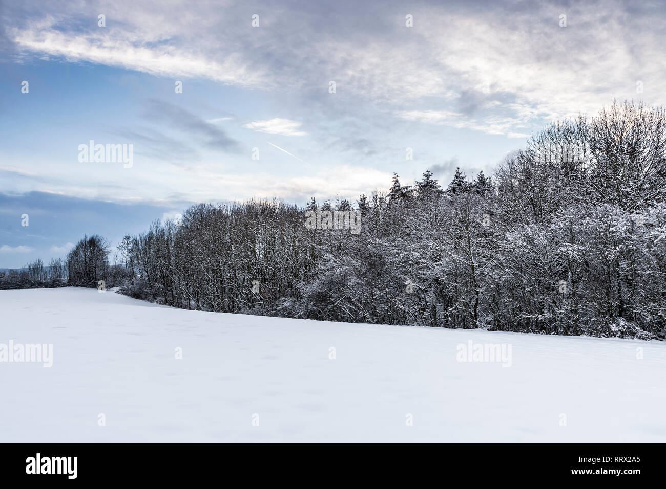 Snowy winter landscape with beautiful sunset sky Stock Photo