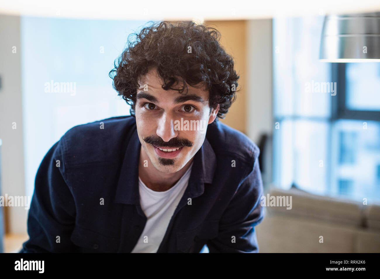 Curly hair brown eyes man portrait hi-res stock photography and images ...