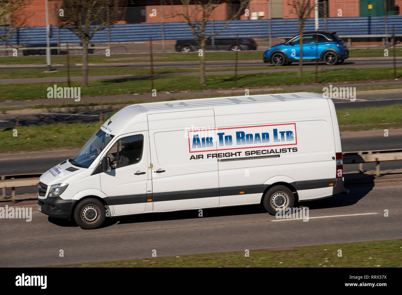 Air to Road Ltd air freight specialists. White van, commercial transport business. Driving on the road. Transportation Stock Photo