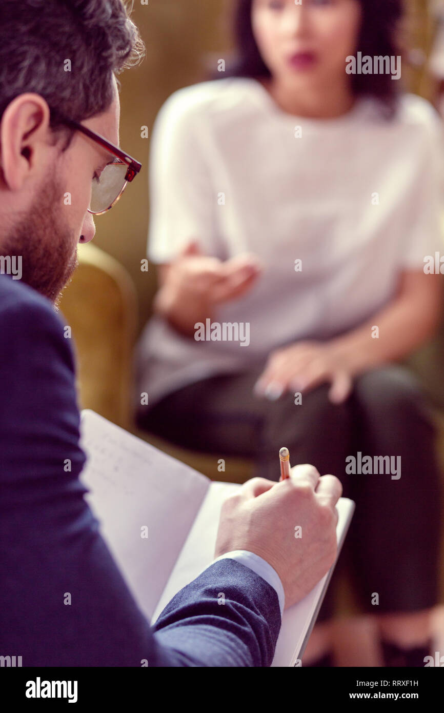 Selective focus of a doctor taking notes Stock Photo