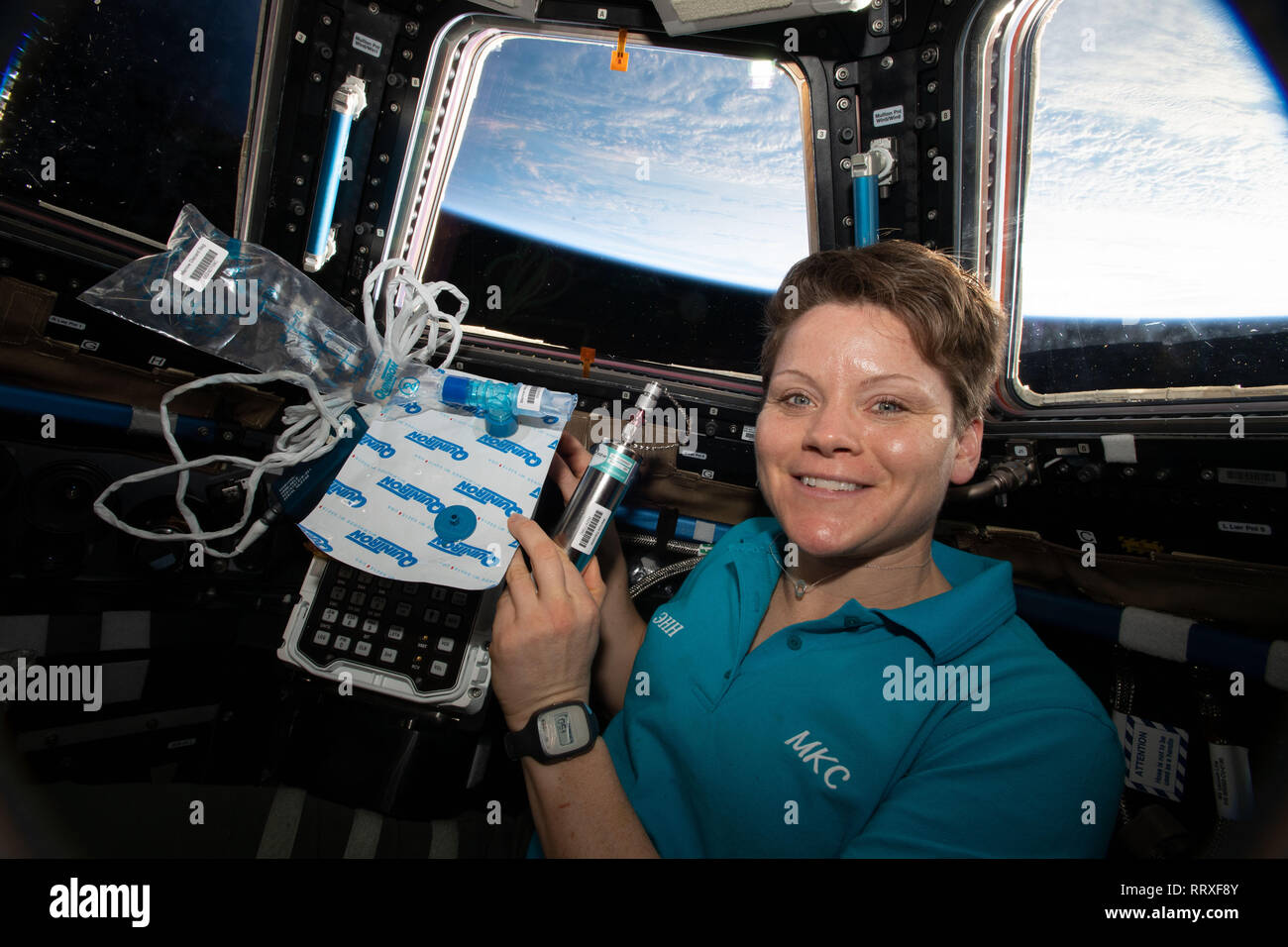 NASA astronaut Anne McClain works inside the the cupola with biomedical gear for the Marrow experiment aboard the International Space Station February 6, 2019 in Earth Orbit. The study measures fat changes in the bone marrow before, and after exposure to microgravity. Stock Photo