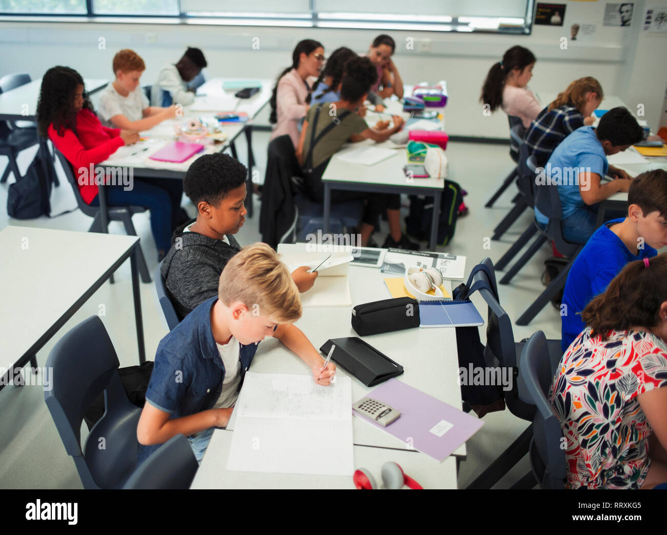 Junior high school students studying in classroom Stock Photo