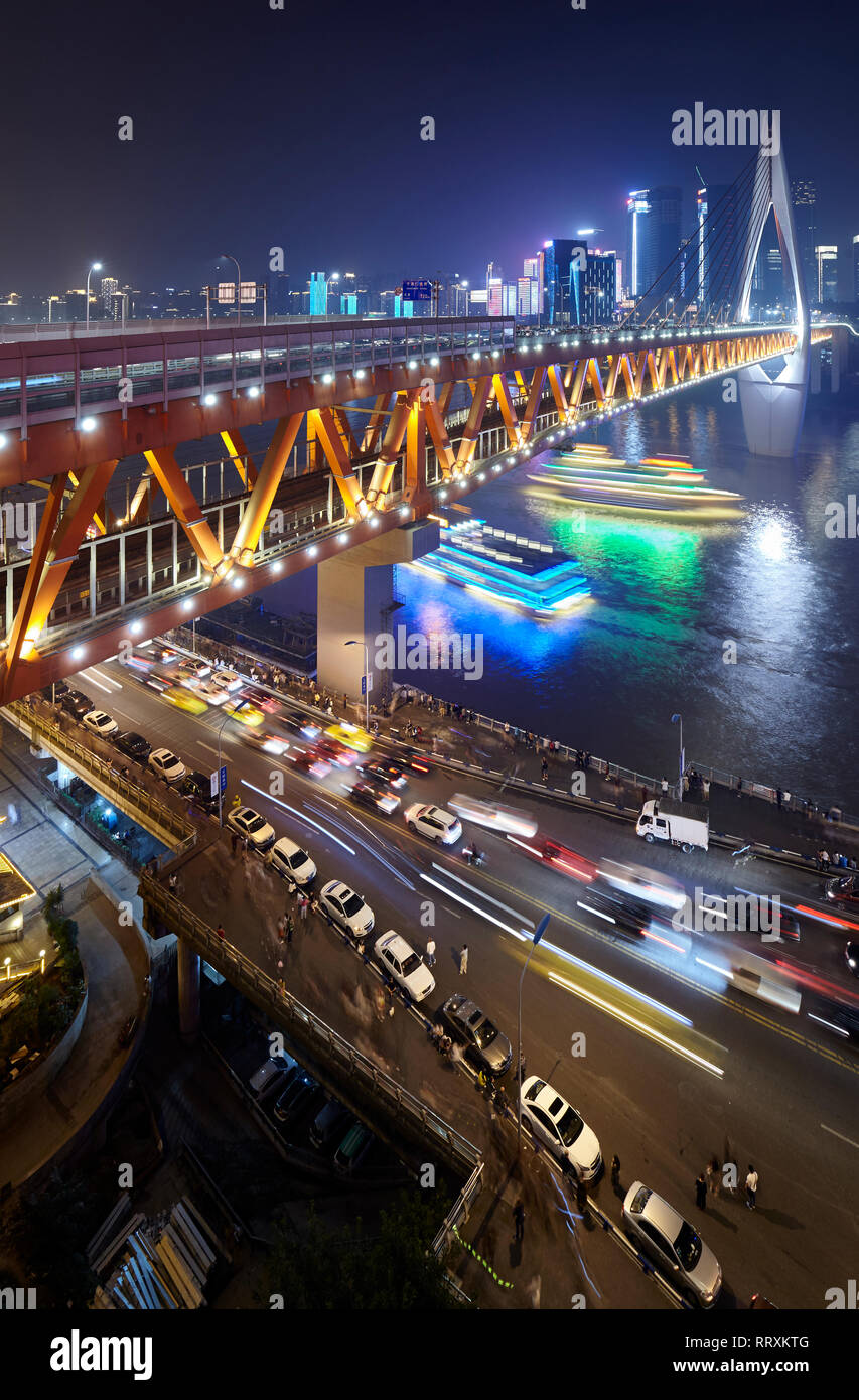 Chongqing, China - October 02, 2017: Dongshuimen bridge over Yangtze River at night. Stock Photo