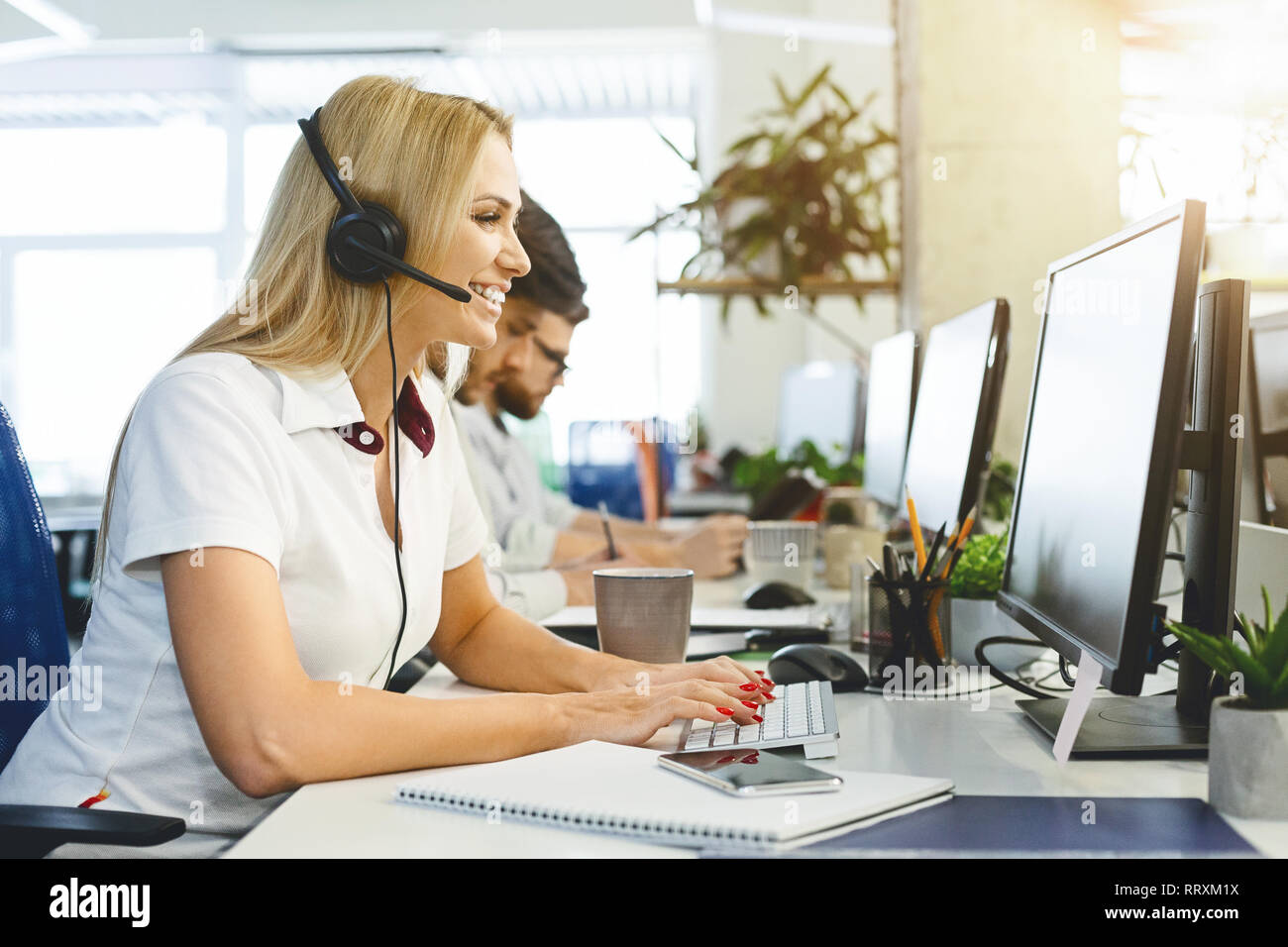 Business woman working at call center office Stock Photo
