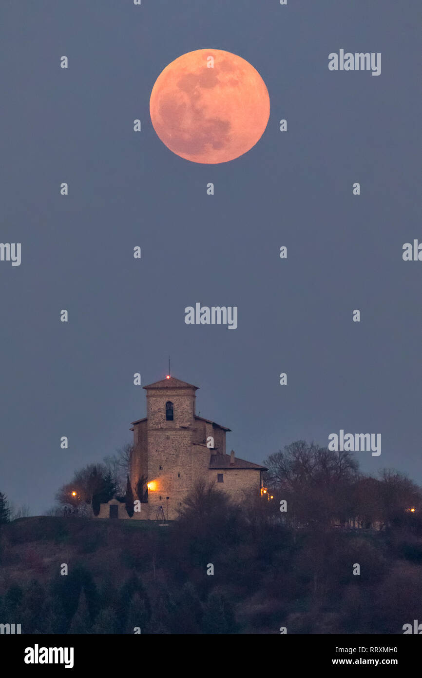 Full moon over Estarrona church in Alava, Spain Stock Photo