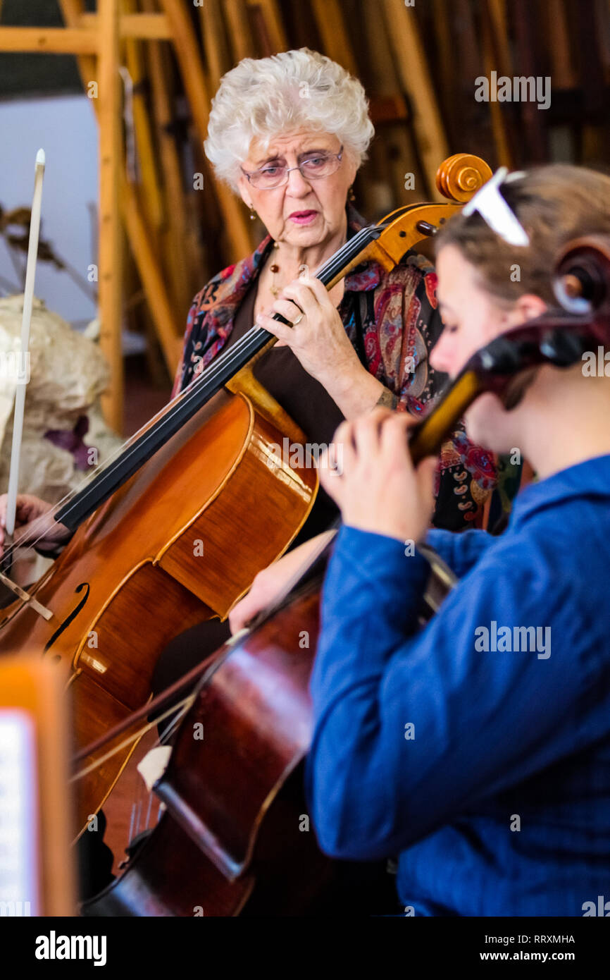 Johannesburg, South Africa - August 28 2010: Teacher at music school orchestra class Stock Photo