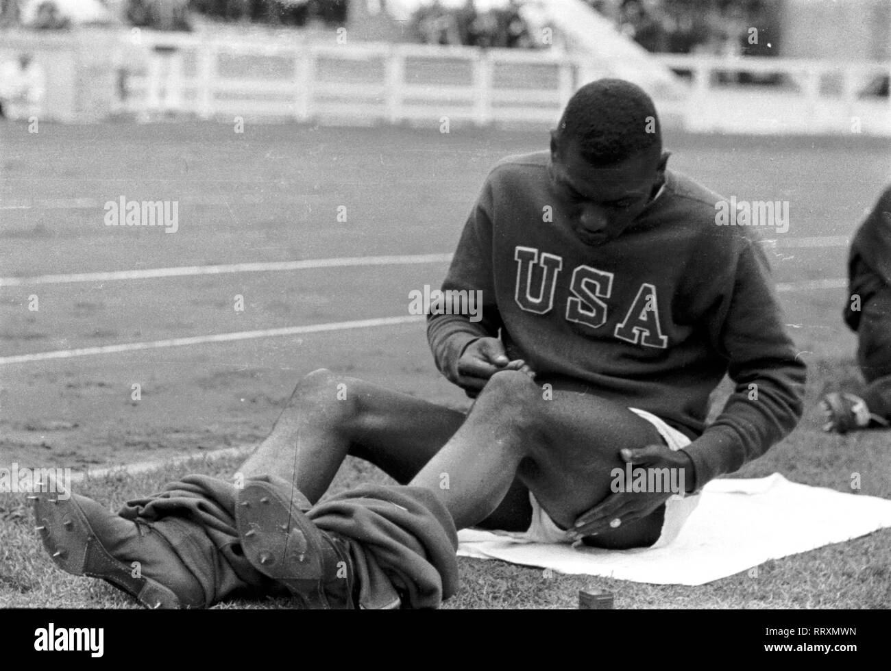 Summer Olympics 1936 - Germany, Third Reich - Olympic Games, Summer Olympics 1936 in Berlin. Jesse Owens during a break at the Olympic arena. The most successful athlete of the Berlin Olympics. Gold medal winner in 100 m and 200 m sprint, 4 x 100 m relay and long jump. Image date August  1936. Photo Erich Andres Stock Photo
