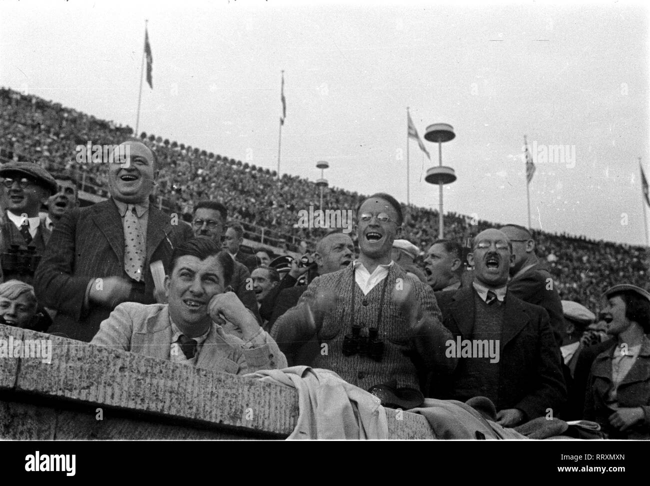 Summer Olympics 1936 - Germany, Third Reich - Olympic Games, Summer Olympics 1936 in Berlin. Enthusiastic spectators at the Olympic stadium. Image date August 1936. Photo Erich Andres Stock Photo