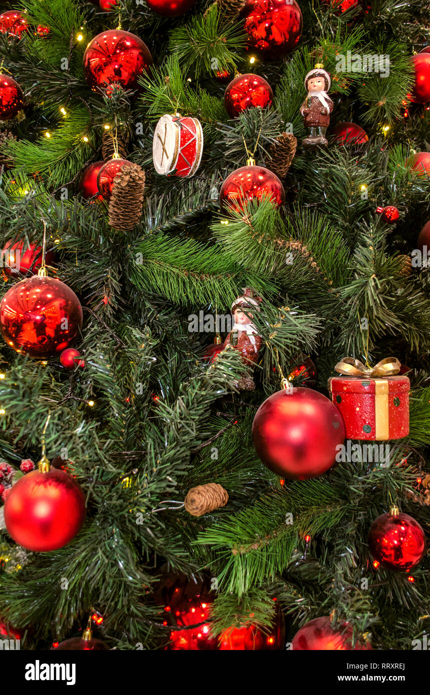 Christmas background of natural and artificial pine branches with old  Christmas decorations figurines, cones and red balls Stock Photo - Alamy