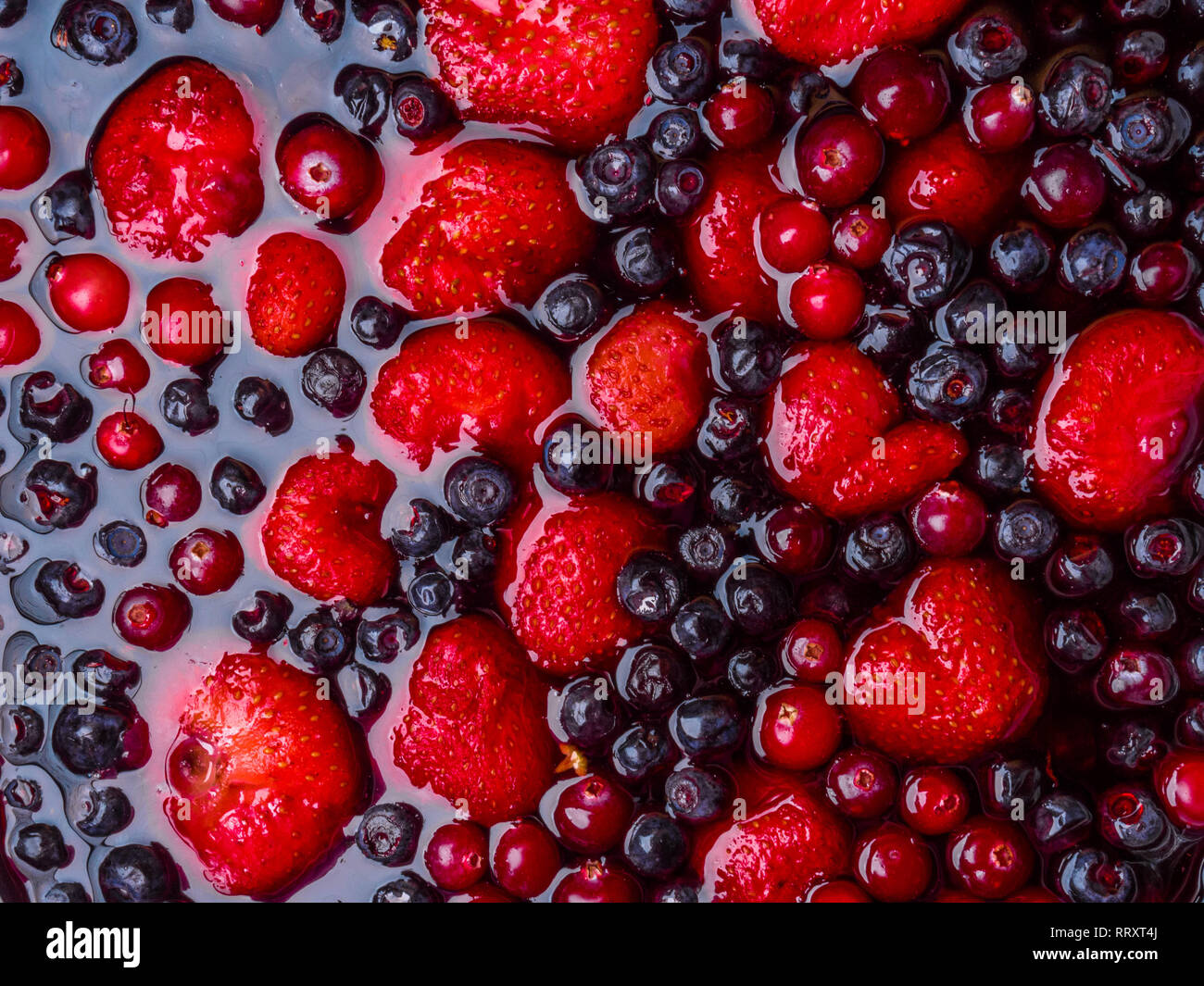 Top view of mixed jelly fruits ( strawberry, blueberry, cranberry