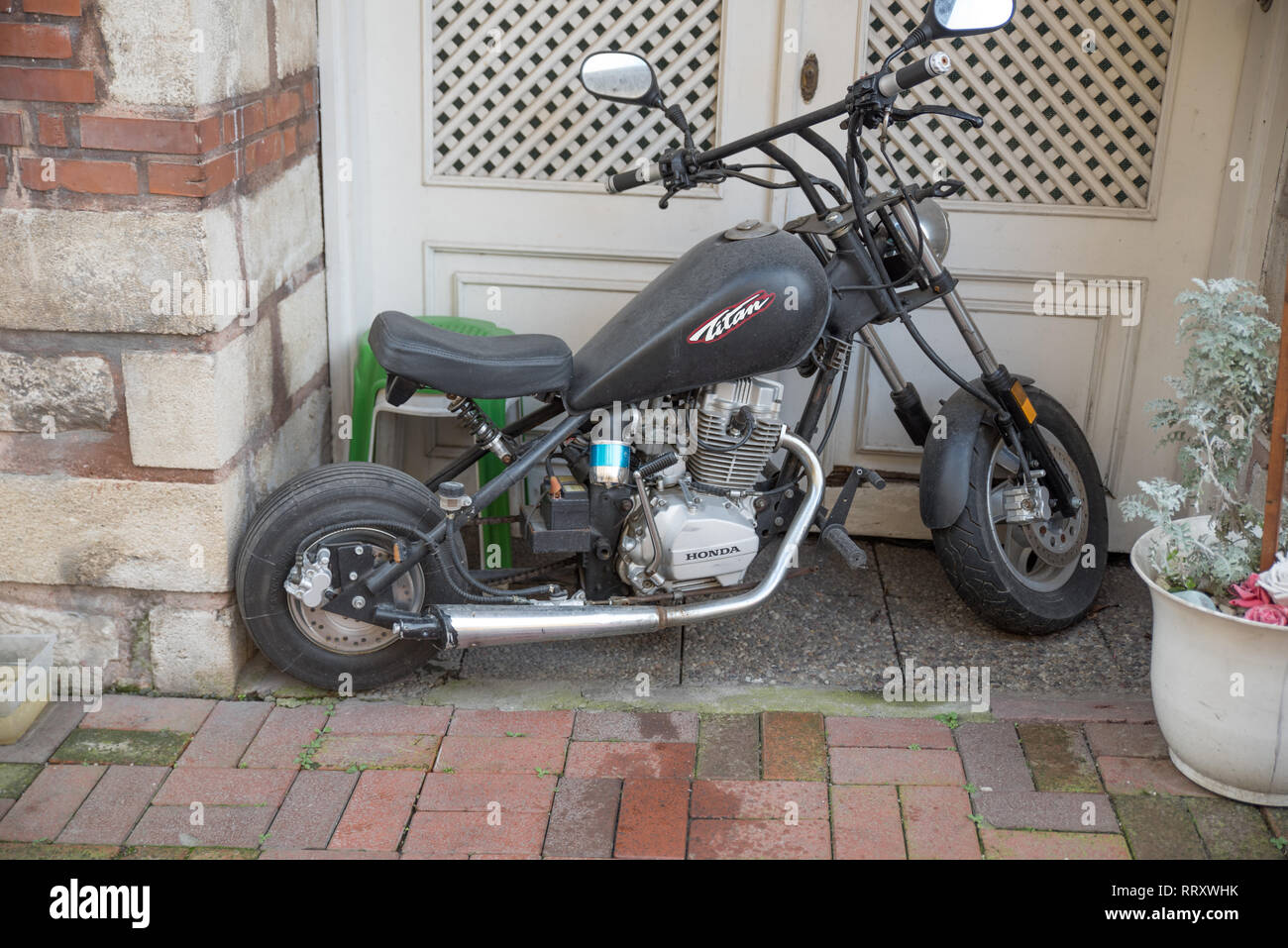A Mini Motorbike Parked In Front Of A Door In Istanbul Stock Photo Alamy