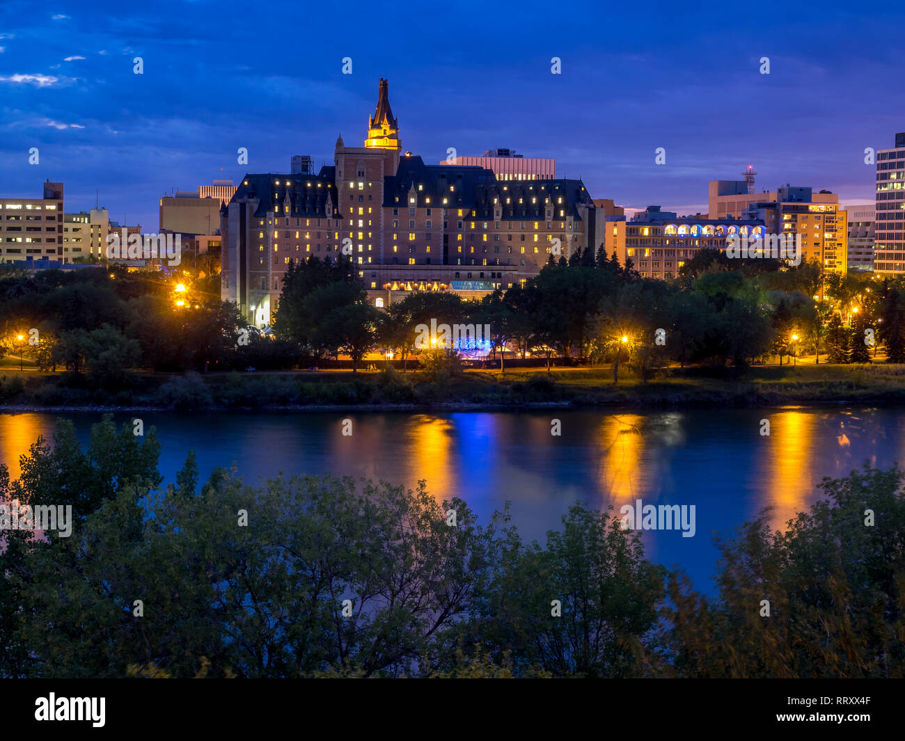 Saskatoon skyline at night along the Saskatchewan River and valley 