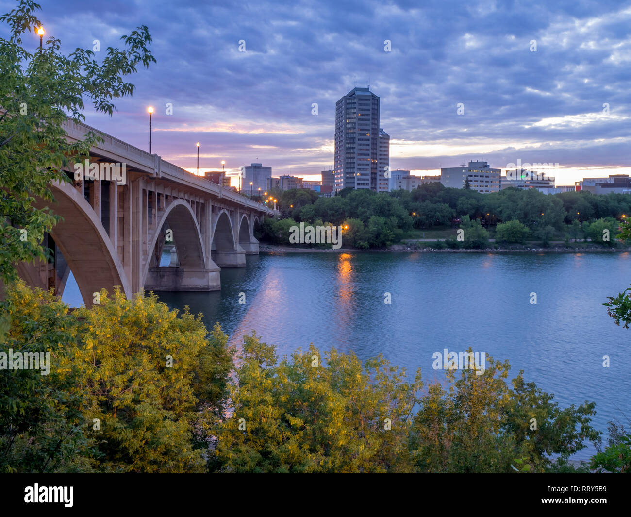 Saskatoon skyline at night along the Saskatchewan River. The 